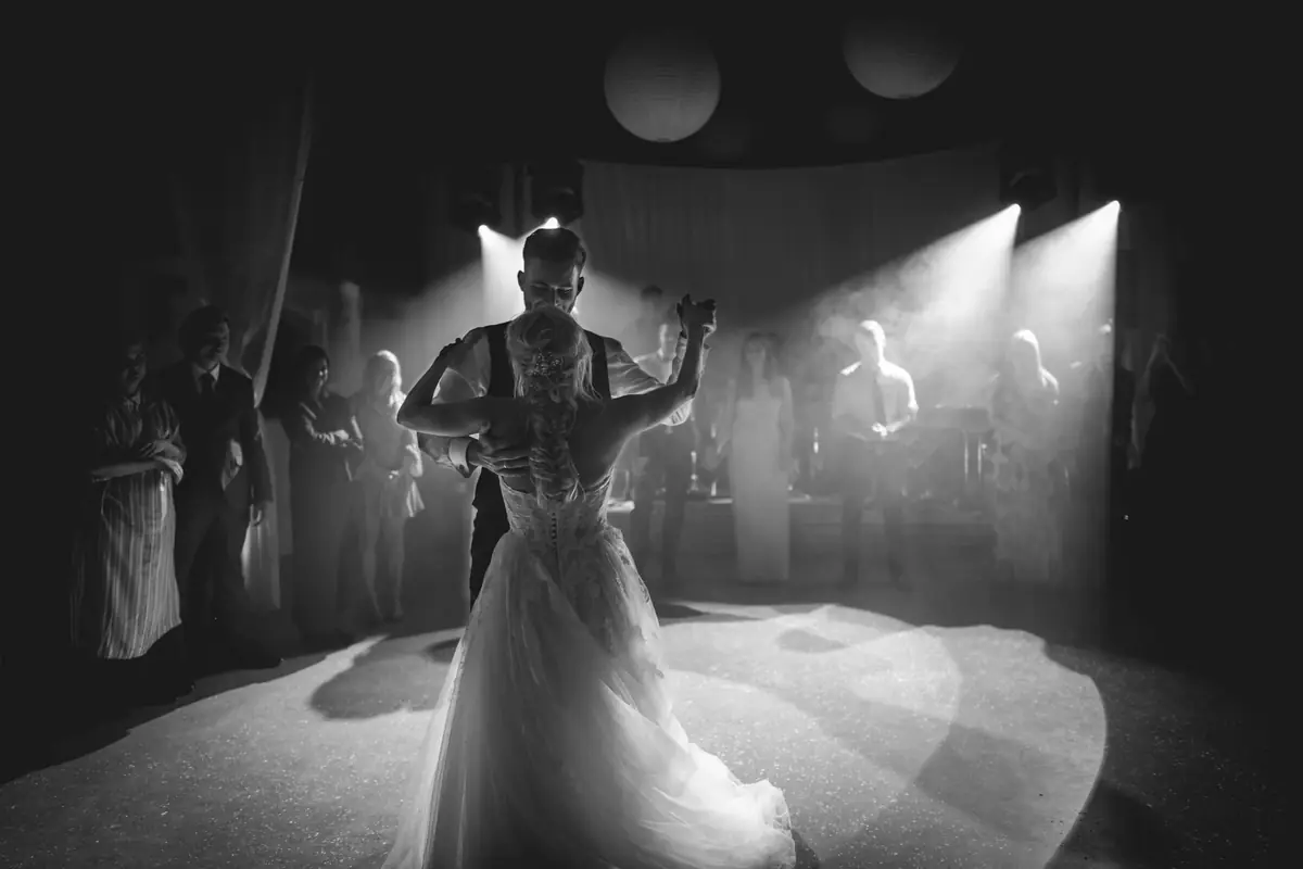 Bride spinning on a dance floor, black and white